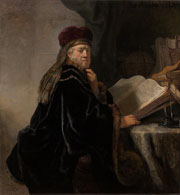 Cuadro de Rembrandt Harmenszoon van Rijn  - Un becario sentado en un escritorio